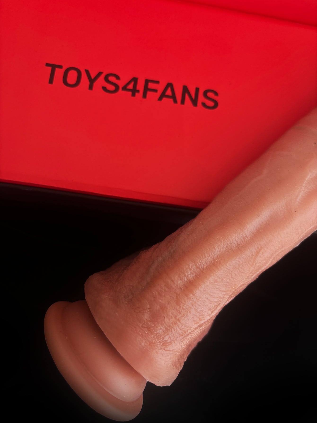 The Gabriel Coimbra Dildo by TOYS4FANS is pictured next to a red box featuring the brand’s logo. Expertly crafted for comfort and safety, this body-safe dildo delivers an ultra-lifelike experience, making it perfect for those who value quality and style.
